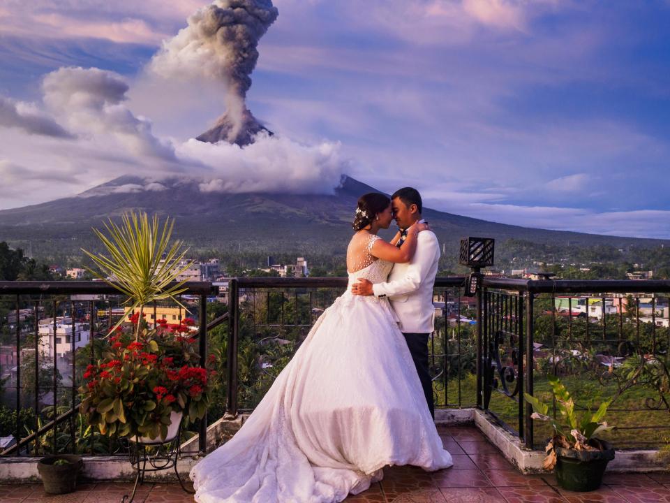 This couple shot their wedding in a breath-taking volcanic eruption backdrop!
